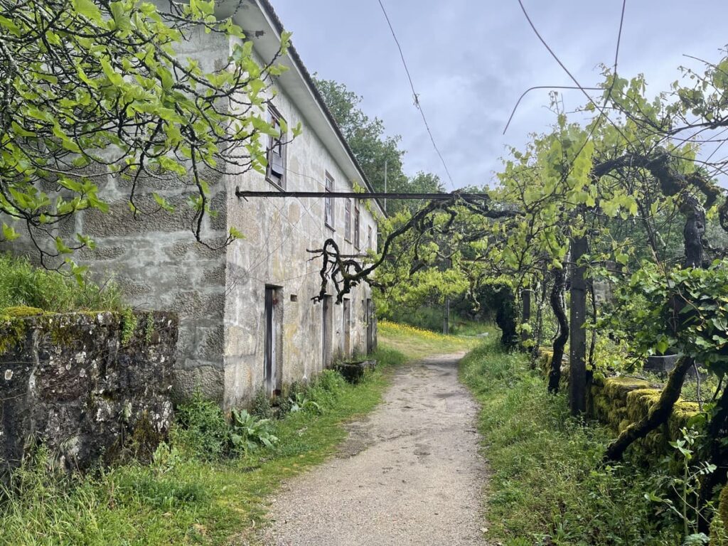 A dirt path by a house in a village near arouca 516 bridge in Portugal
