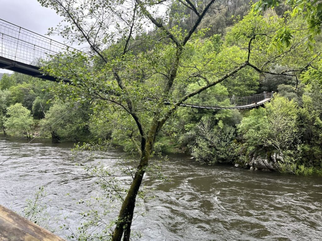 A small suspension bridge over the river on Paiva Walkways trail in Portugal