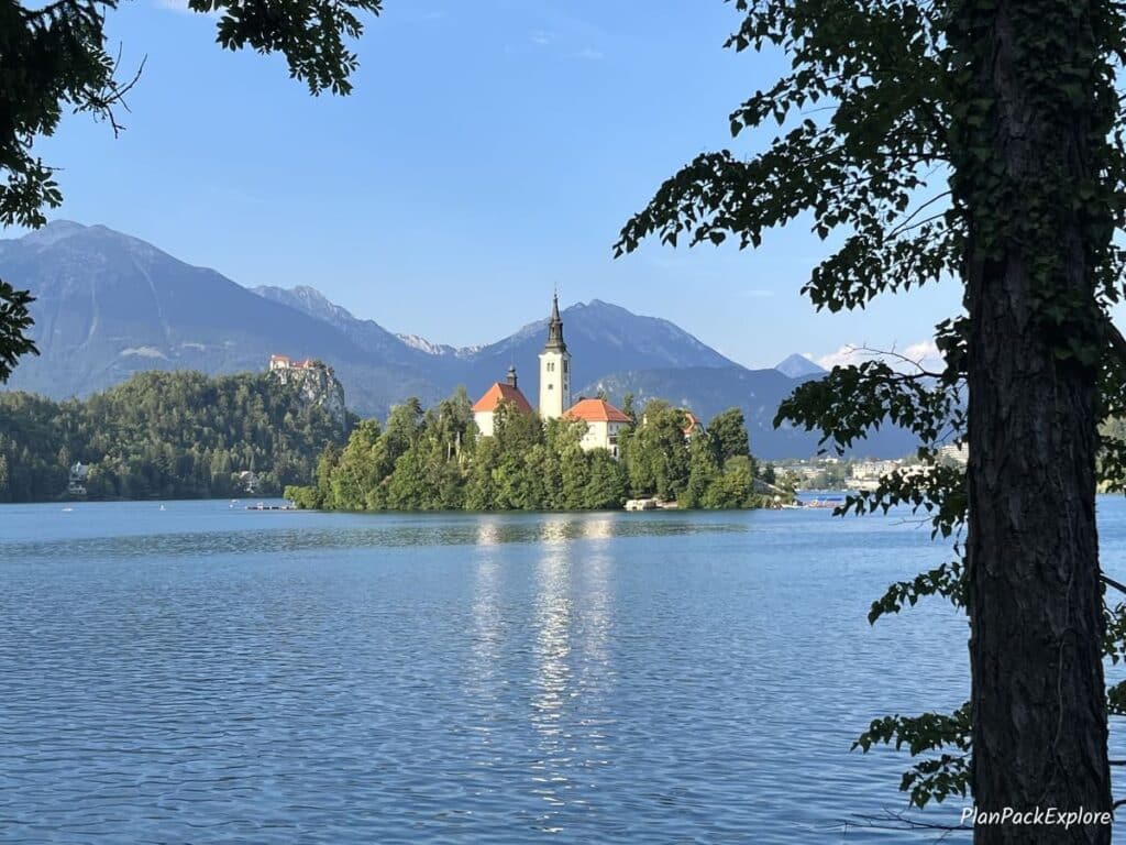 A view of a lake with a small island in the middle in Bled, Slovenia.