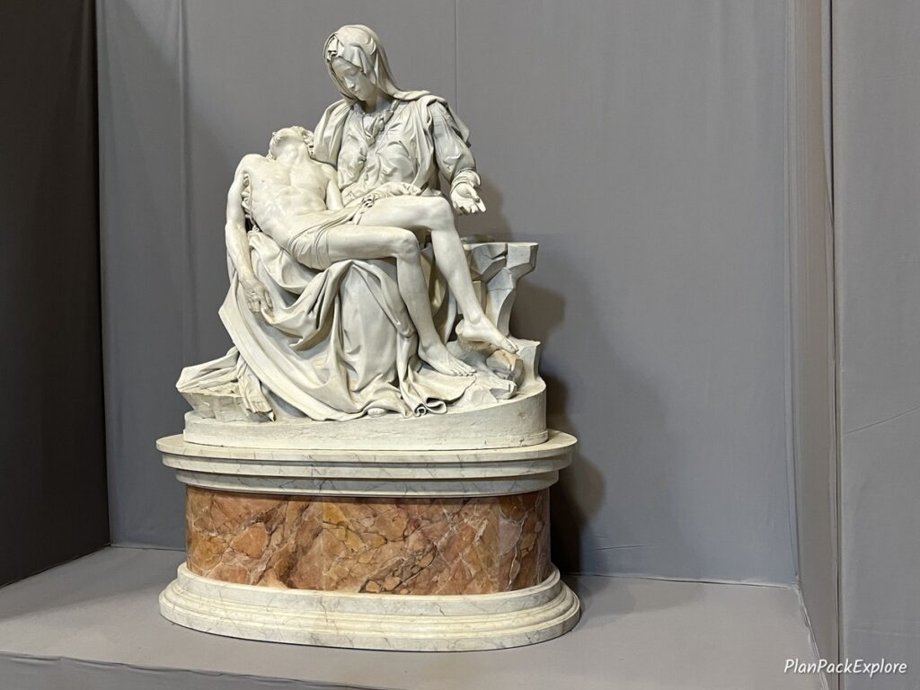 A marble sculpture on Mary holding Jesus, called "Pieta", inside St. Peter's Basilica in Italy.