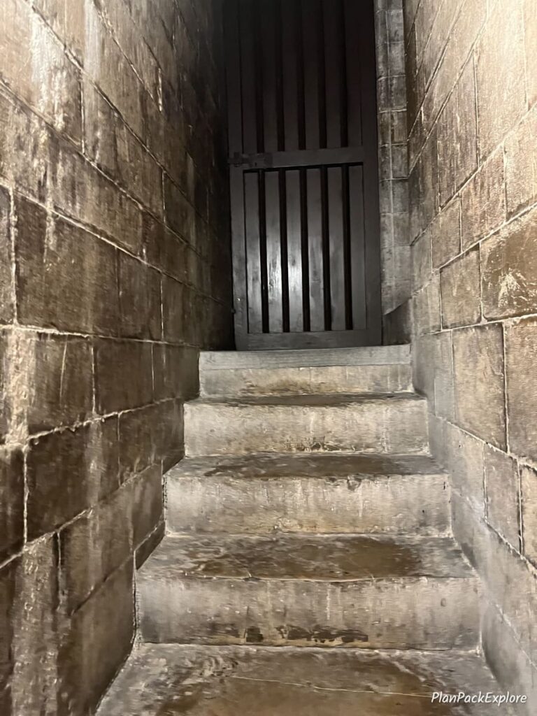 Narrow stone stairs leading to the top of the Florence Cathedral dome in Italy.