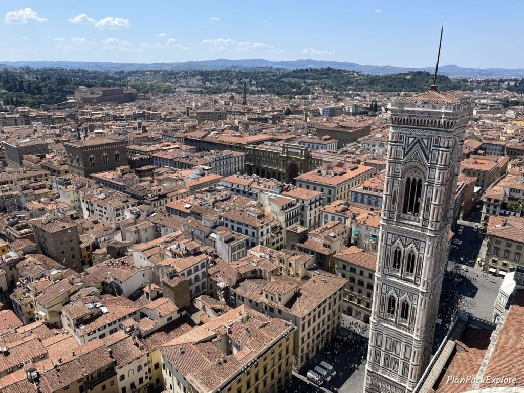 An aerial view of Florence rooftops and the bell tower from the viewing area of the Duomo in Italy.