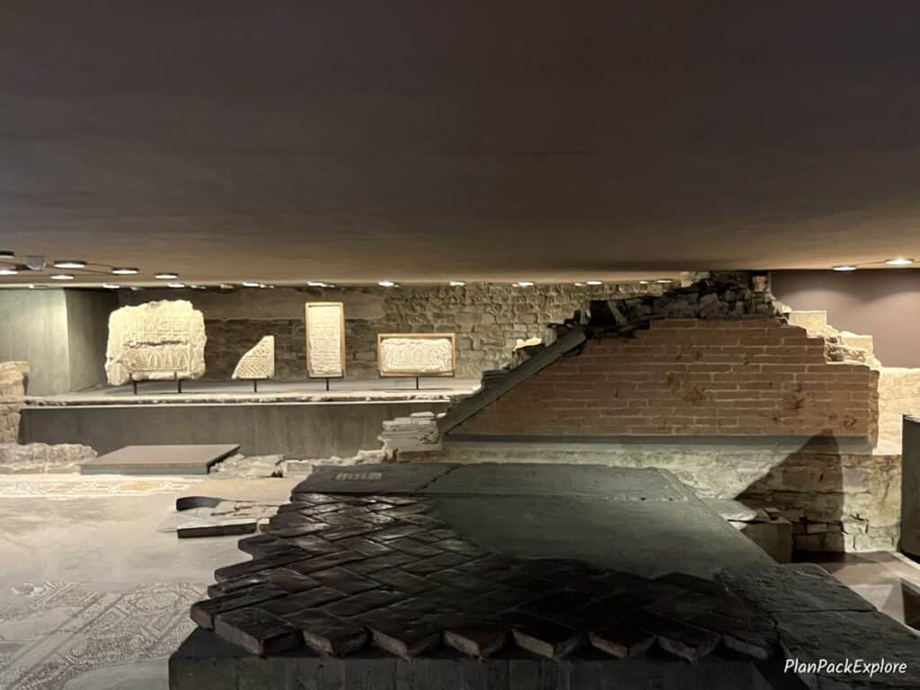 A room with fragments of stone walls and floor mosaics at Santa Reparata at the Florence Cathedral in Italy.