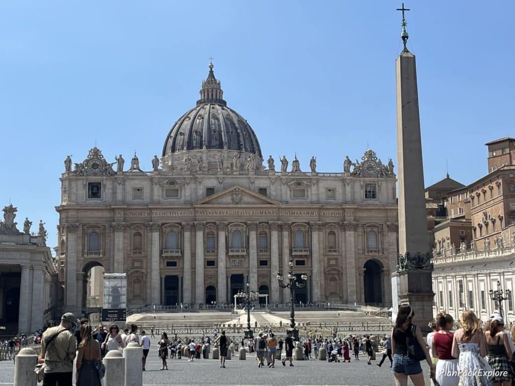 A large church with a dome, called St. Peter's Basilica in the Vatican City, Italy.