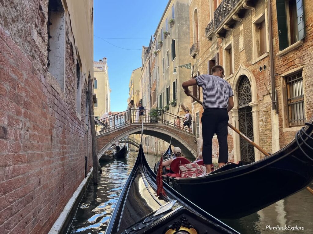 A gondola near a bridge on a canal in Venice, Italy.
