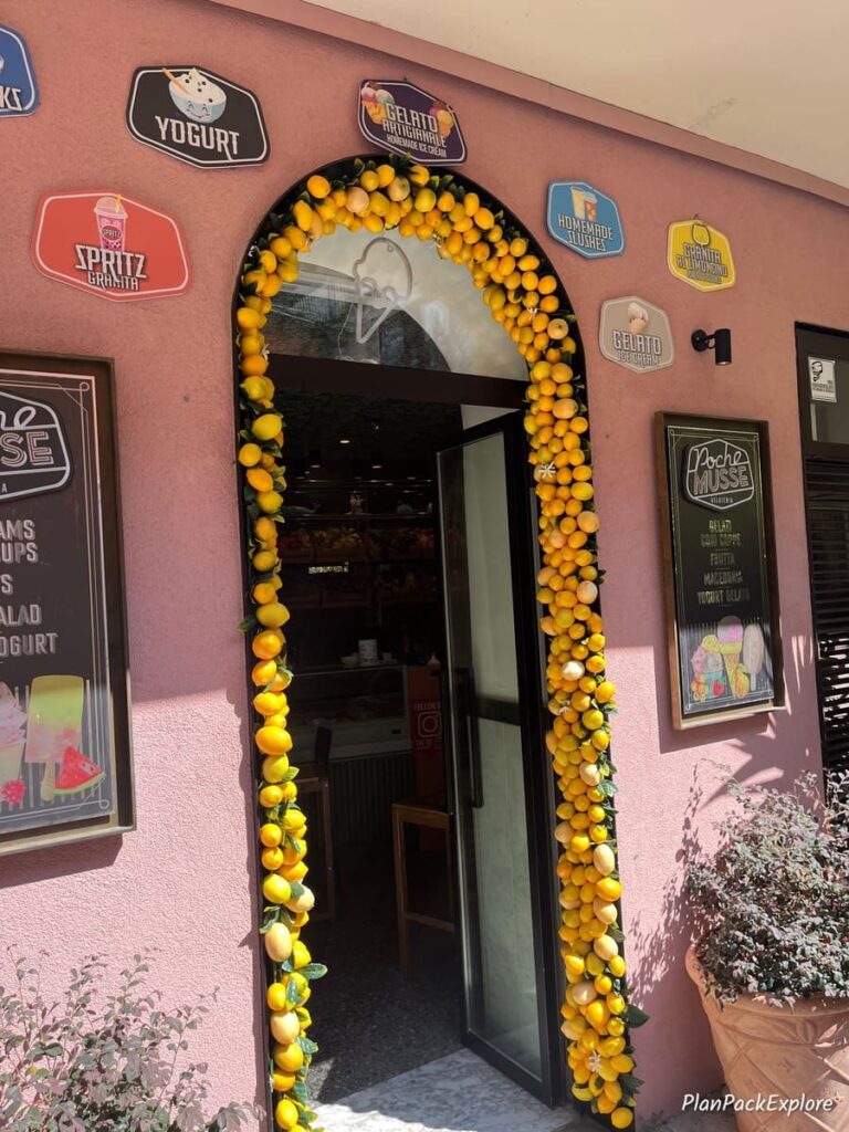 An entry door to a small cafe. lined with real oranges, in Manarola, Cinque Terre, Italy.
