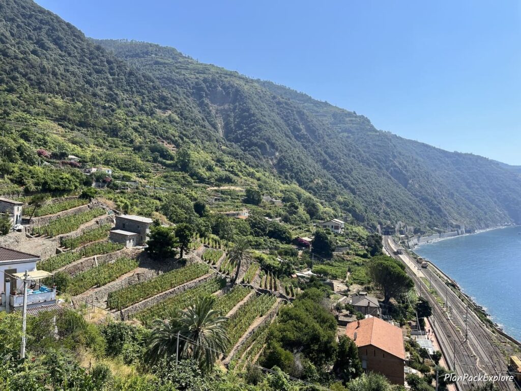 A view of the sea and the train station from the staircase above in Corniglia, Cinque Terre, Italy.