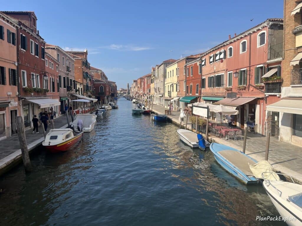 Historic houses along the canal on Murano Island in Italy.
