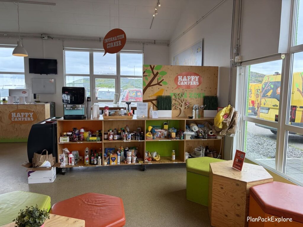 A shelf with non-perishable products and a coffee maker on top, inside the Happy Campers rental office in Iceland.