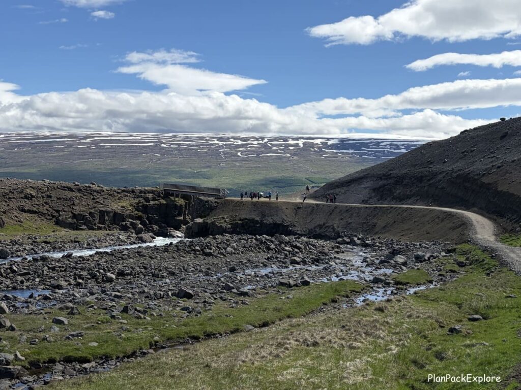 A path along a river on the hiking trail to Hengifoss waterfall in Iceland.