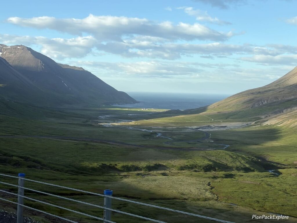 A winding mountain road leading down to the fjord of Borgarfjordur Eystri in Iceland.