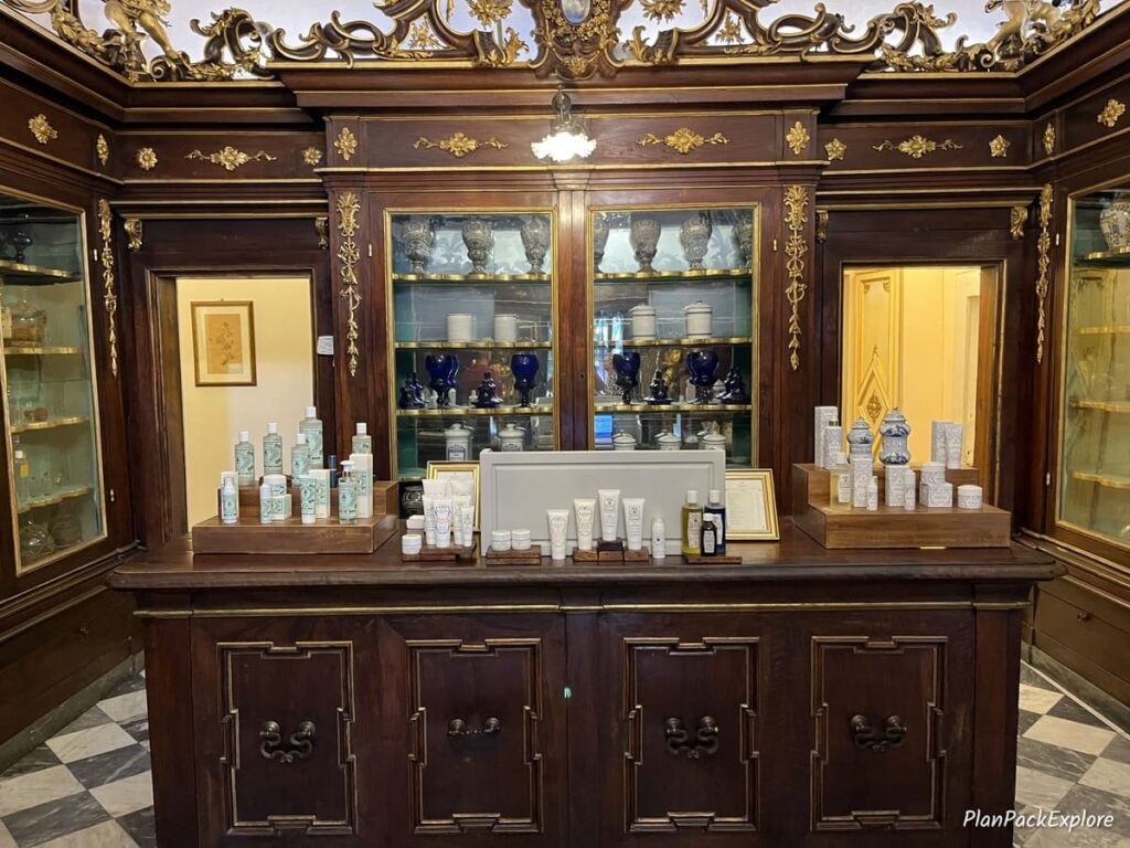 A vintage display case in a historic pharmacy in Florence, Italy.