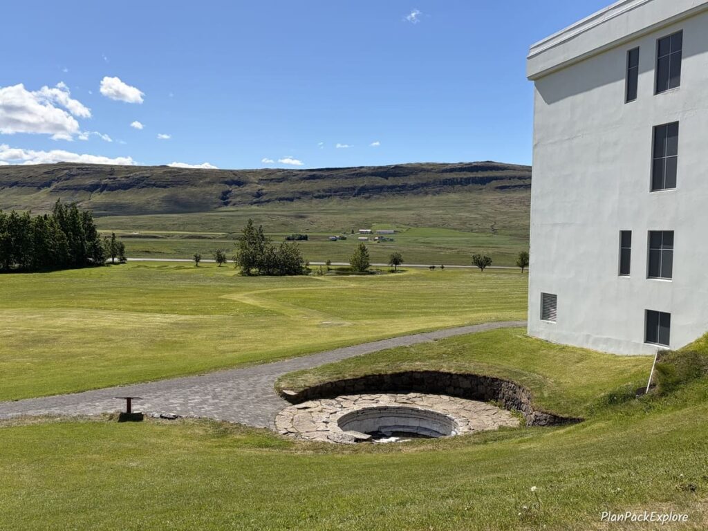 A small round stone pool at the Reykholt historical site on the Silver Circle in Iceland.